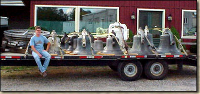 A flatbed truck filled with bells
